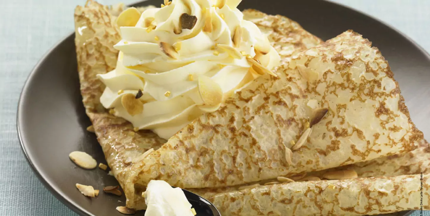 Crêpes with Passion Fruit Whipped Cream and Flaked Almonds